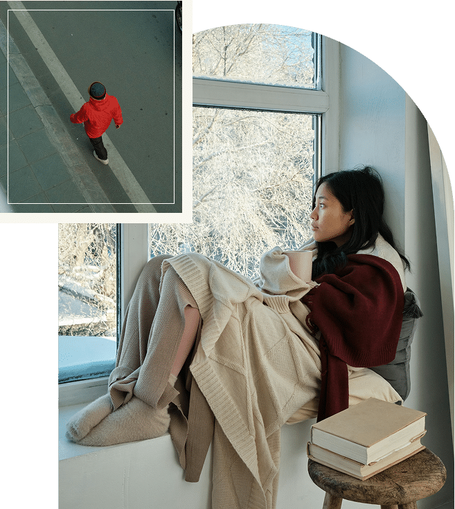 Asian woman looking out window at beautiful view practicing mindfulness from DBT therapy sessions in Atlanta Georgia area