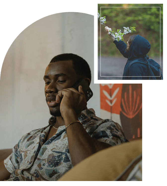 African American man on the phone outdoors, attentive posture reflecting communication and real-life connectionWoman reaching toward flowers on a branch, gentle movement symbolizing curiosity, care, and emotional attunement