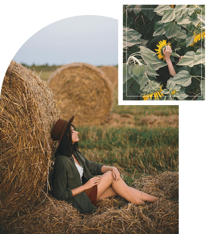 Girl sitting beside a haystack with eyes closed, grounded posture conveying rest and connection to nature
