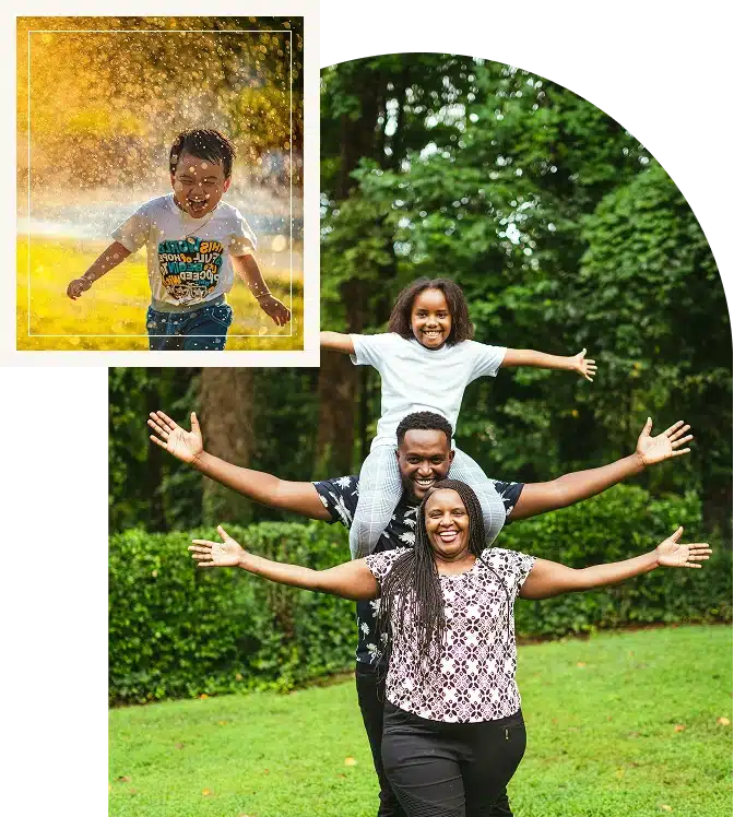 African American family smiling together, as the daughter rides happily on her father's shoulders during a joyful day!
