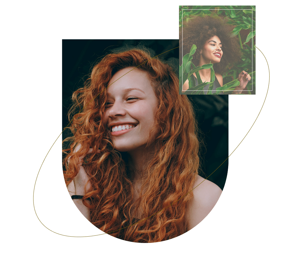 Two girls smiling together while enjoying nature with a green background