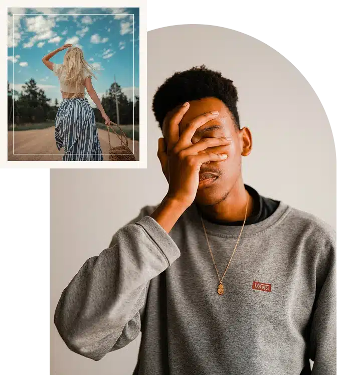 An African American man resting his face in his hand, appearing thoughtful and emotionally reflective