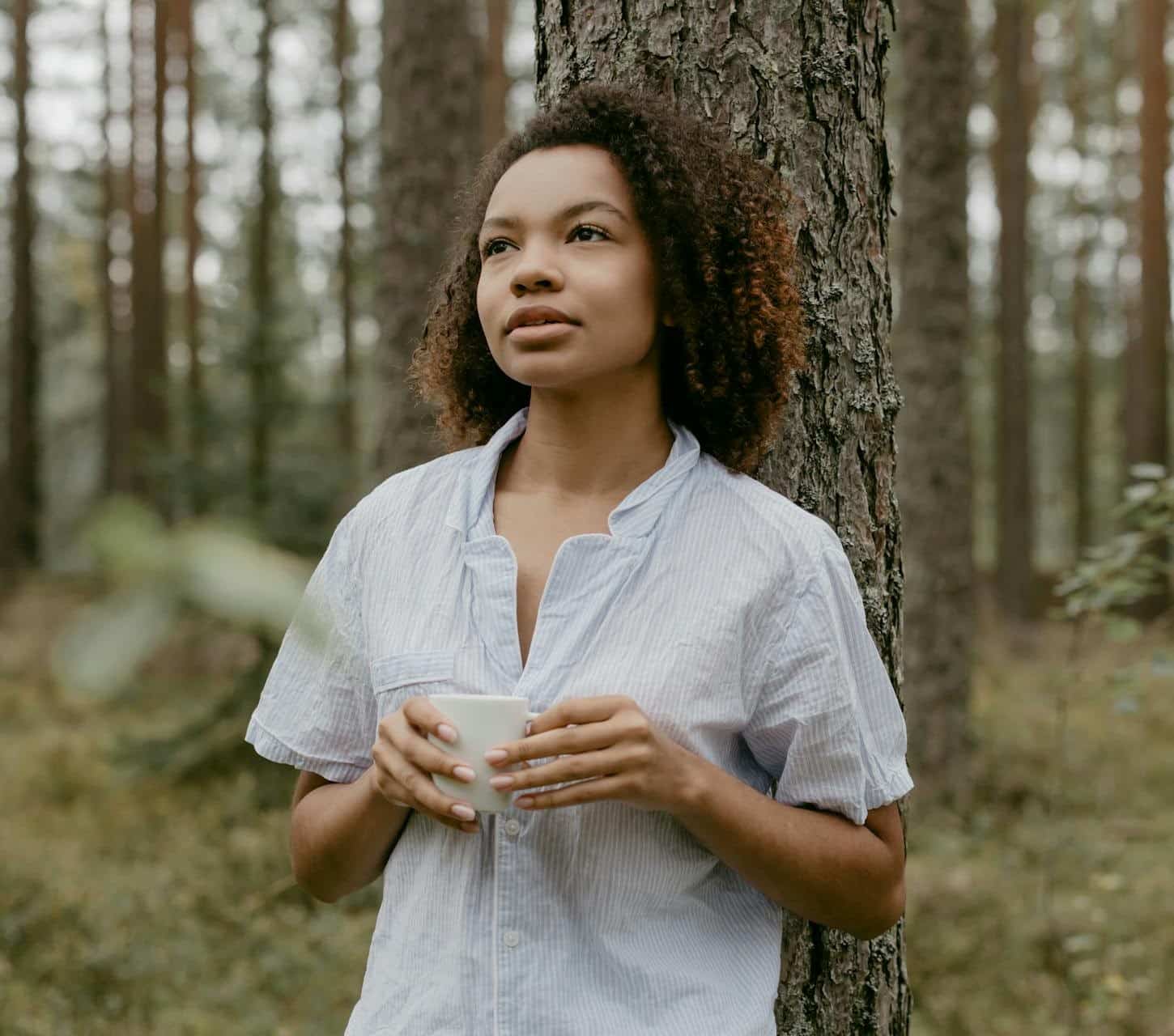 Black woman with backpack overlooking Atlanta city skyline feeling empowered after DBT therapy treatment in Georgia area