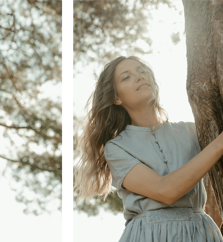 Intimate couple embracing by skyscraper window with city view strengthening relationship through DBT therapy in Atlanta GA