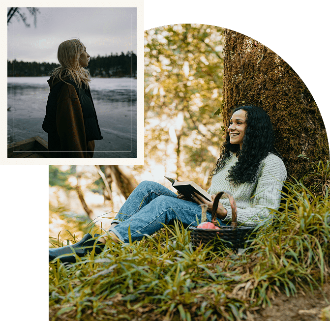A woman sits against a large moss-covered tree that conveys reflection, relaxation, and connection with nature.