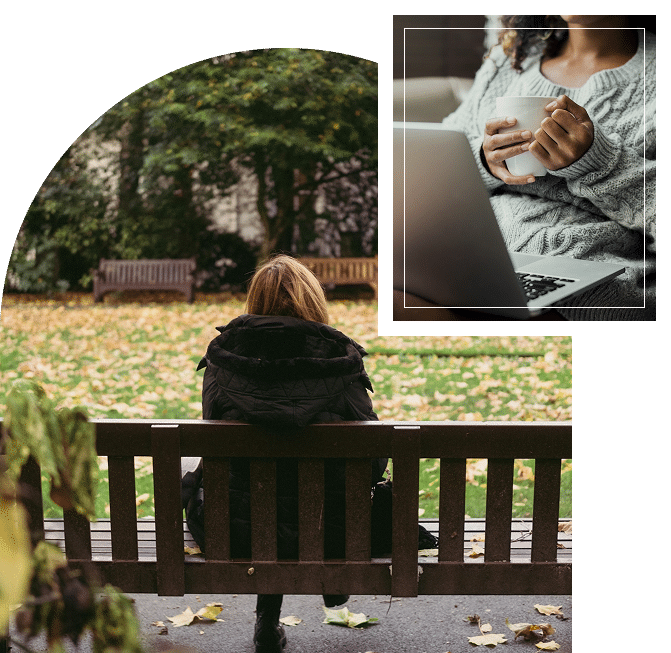 Woman in a jacket sitting on a bench at a park