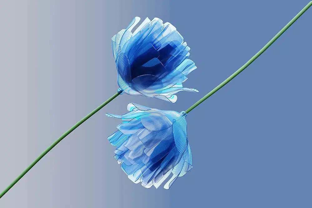 blue flower on a stem against a blue sky