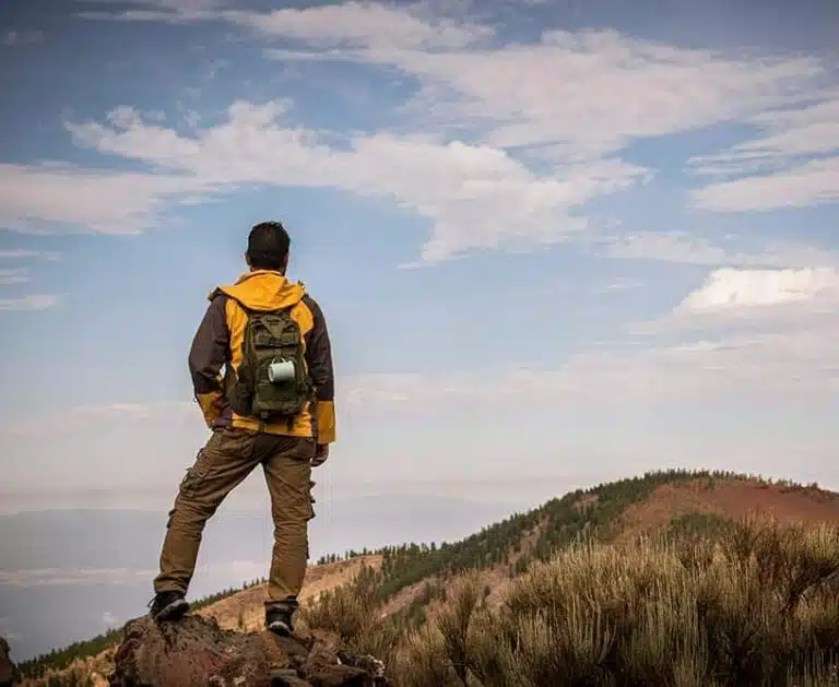 lonely man in trekking adventure discover activity at the mountain